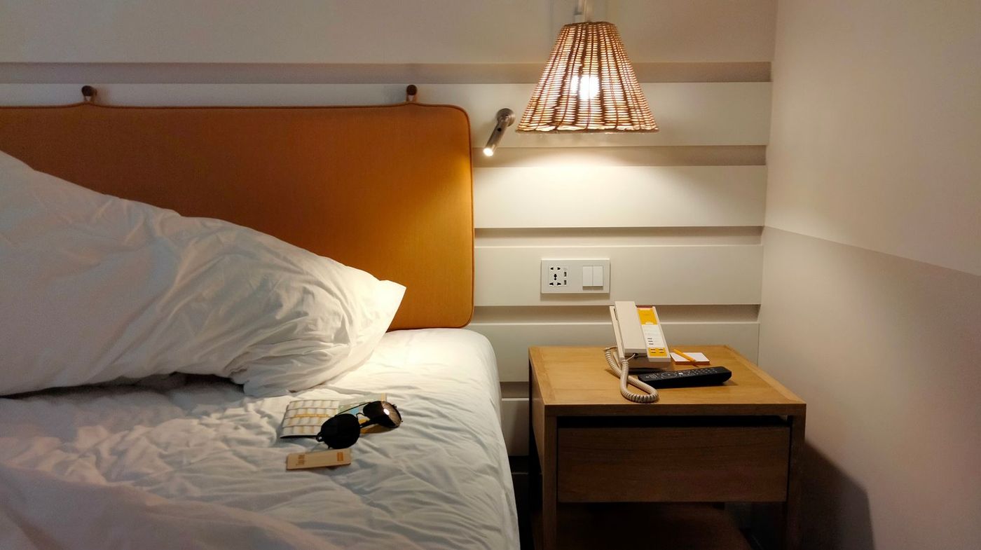 Crisp, hotel-style bed with fresh white linens in a vacation rental